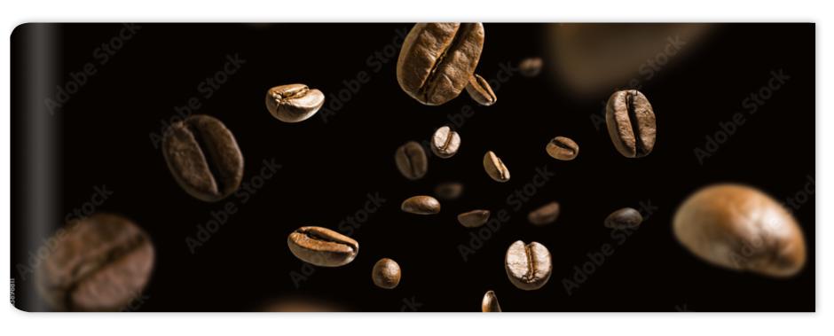 Fototapeta Coffee beans in flight on a